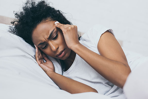 woman suffering from migraine headache